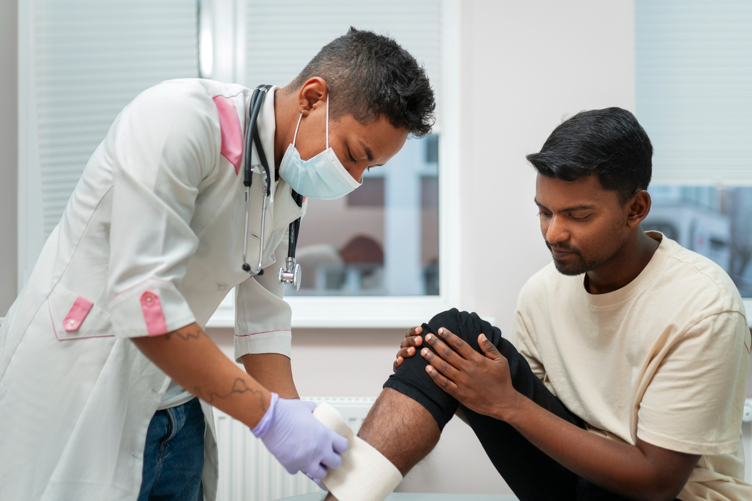 Indian doctor consulting a patient in clinic